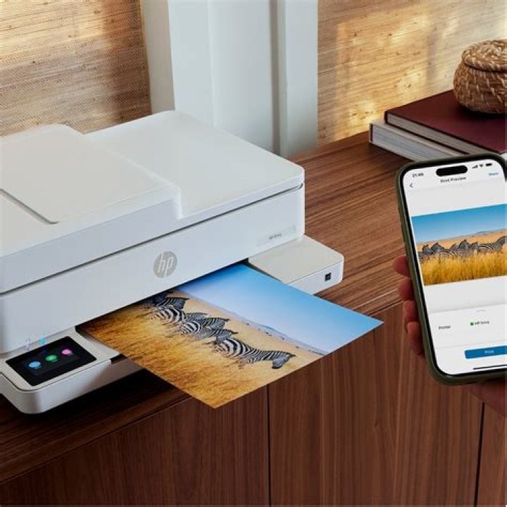 Can HP ENVY 5530 print photos?