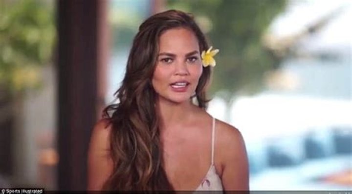 Chrissy Teigen Shows Off Implant-Free Breasts In Swimsuit As She Struggles To Make Them Go ‘Up’