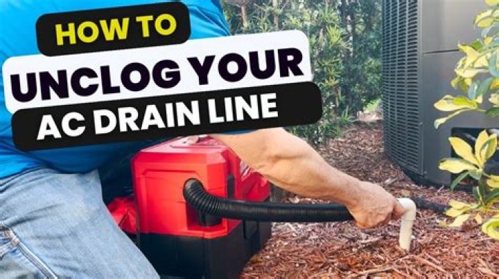 How do I unclog my car AC drain pipe?