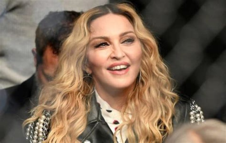 Madonna, 62, Is Nearly Unrecognizable With Platinum Blonde Hair & A Green Robe In New Selfies