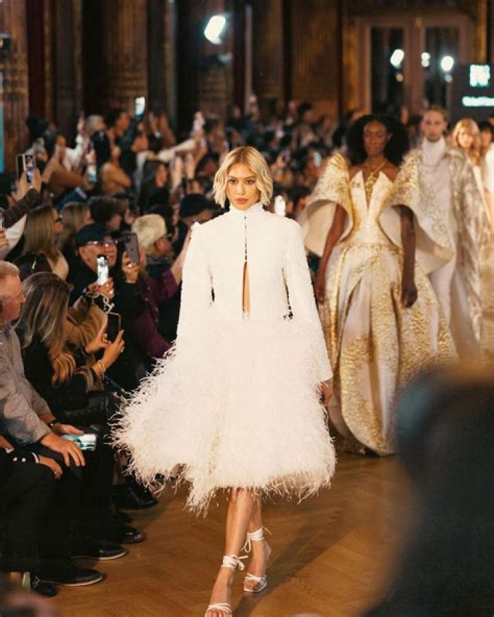 Reveals Abs At Paris Fashion Week – Pic – Hollywood Life