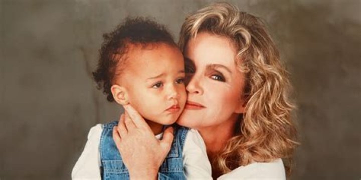 Why did Charlize Theron get adopted?
