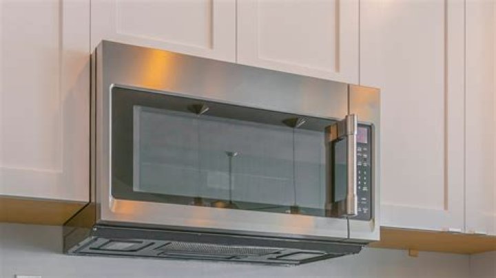 Why does my microwave run when I open the door?